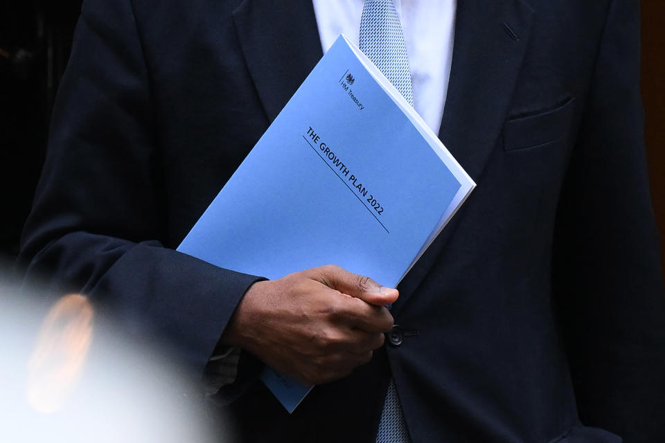 Kwasi Kwarteng holds a folder reading 'The Growth Plan 2022' as he walks out of Number 11 Downing Street. Photo: Daniel Leal/AFP via Getty