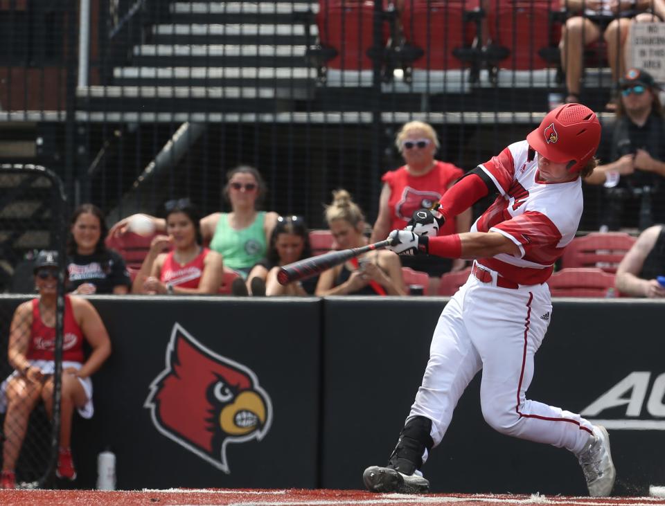 Louisville’s Dalton Rushing gets a single against Virginia in the last game of the regular season.May 21, 2022
