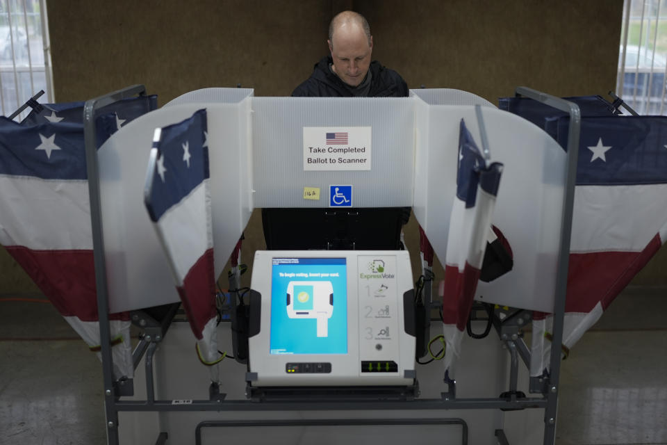 Doug Scopel votes a ballot at a polling place, Tuesday, March 5, 2024, in Nashville, Tenn. Super Tuesday elections are being held in 16 states and one territory. Hundreds of delegates are at stake, the biggest haul for either party on a single day. (AP Photo/George Walker IV)