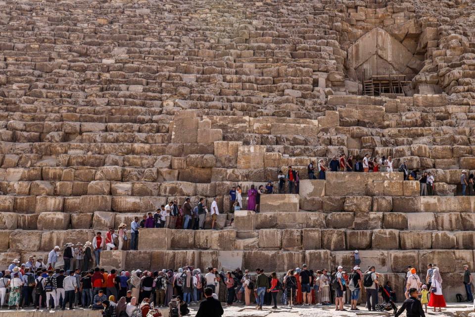 Tourists visit the Great Pyramid of Khufu (Cheops) at the Giza Pyramids necropolis near Cairo (AFP via Getty Images)