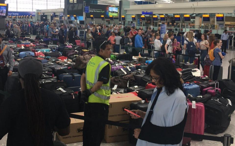 At Heathrow the delays led to mountains of luggage and snaking queues as customers could not board flights. BA is experiencing a "global system outage" - Credit: Cheryl Sullivan/Twitter