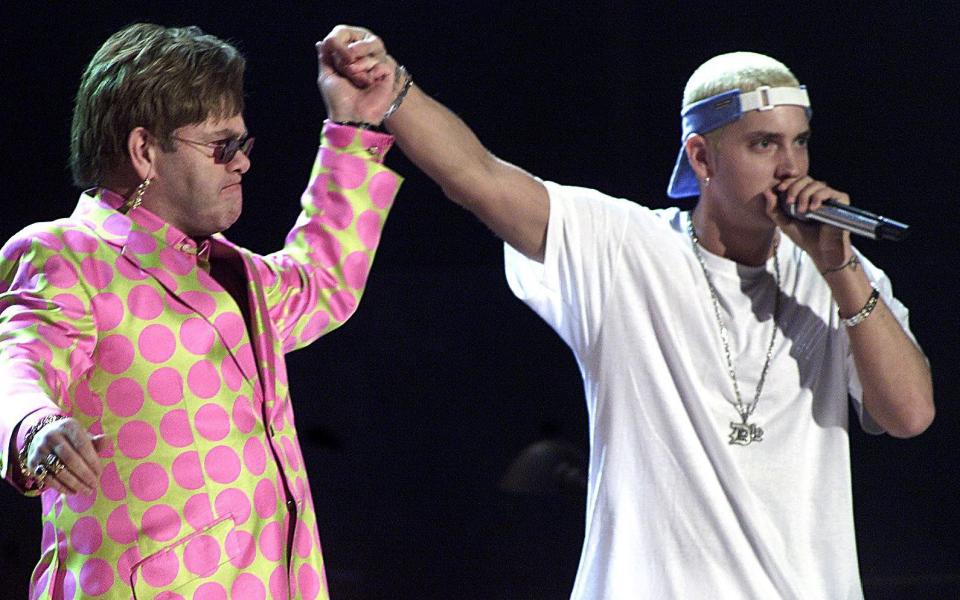 Elton John became an unlikely fan of the rapper, performing with him at the 2001 Grammys - AFP