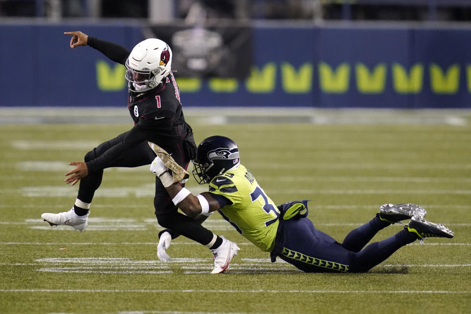 Seattle Seahawks strong safety Jamal Adams, right, gets to Arizona Cardinals quarterback Kyler Murray (1) just as Murray gets a pass off, during the second half of an NFL football game, Thursday, Nov. 19, 2020, in Seattle. (AP Photo/Elaine Thompson)