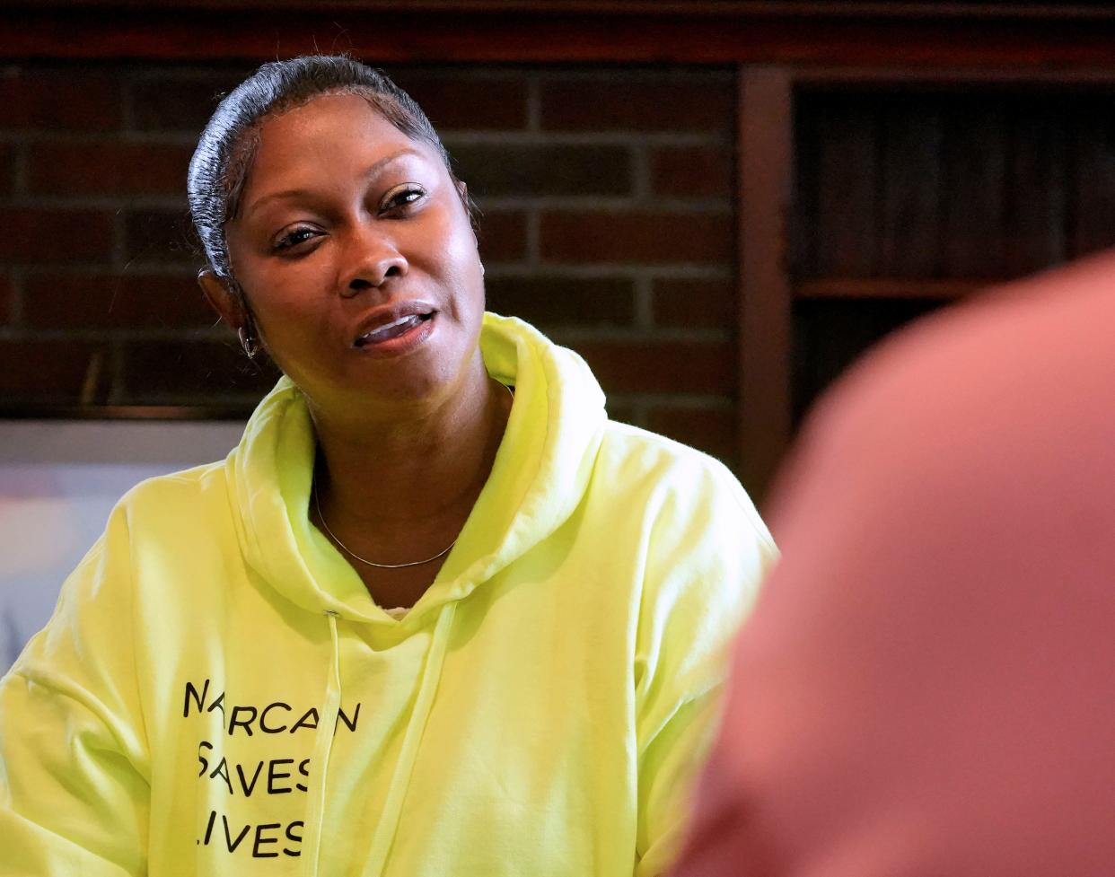 Tahira Malik, left, owner and founder of Samad’s House, a sober living home that helps women recovering from substance abuse, talks with one of the residents living at the house in Milwaukee.