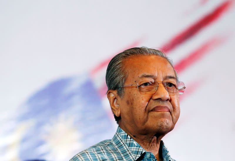 FILE PHOTO: Former Malaysian Prime Minister Mahathir Mohamad attends a meeting of political and civil leaders looking to change the government in Kuala Lumpur, Malaysia
