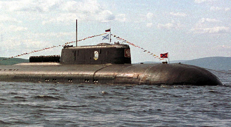 The crew of the Kursk nuclear submarine lines up on its deck.