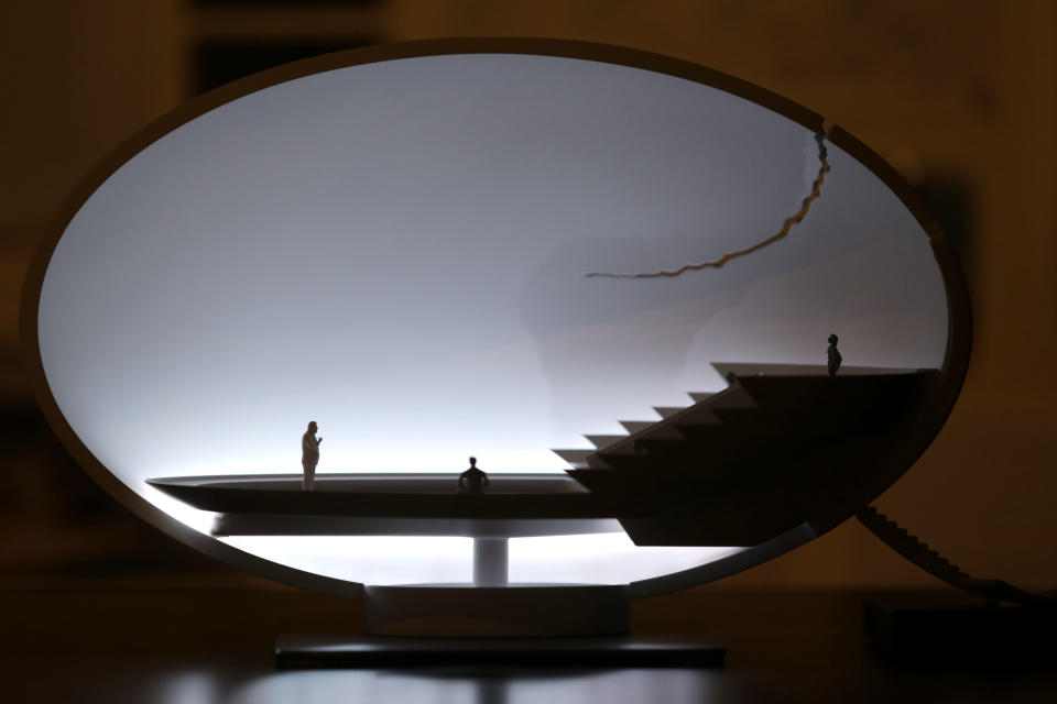 A table lamp called 'Broken Egg' designed by German designer Ingo Mauer is displayed at Milan's Design Fair, in Milan, Italy, Friday, April 12, 2013. The Milan furniture and design week fair is a six-day event which ends next Sunday. (AP Photo/Luca Bruno)