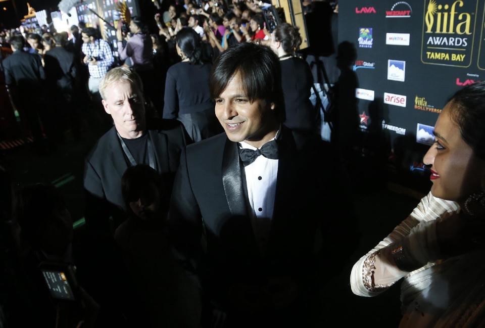 Indian film star Vivek Oberoi walks the green carpet as he arrives for the 15th annual International Indian Film Awards on Saturday, April 26, 2014, in Tampa, Fla. (AP Photo/Brian Blanco)