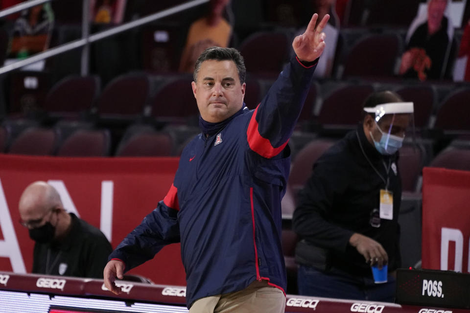 Arizona head coach Sean Miller waves after a win over Southern California during an NCAA college basketball game Saturday, Feb. 20, 2021, in Los Angeles. (AP Photo/Marcio Jose Sanchez)