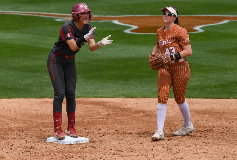 OU's Jayda Coleman (24) claps after making it to second base during Sunday's 2-1 loss to Texas at McCombs Field in Austin.