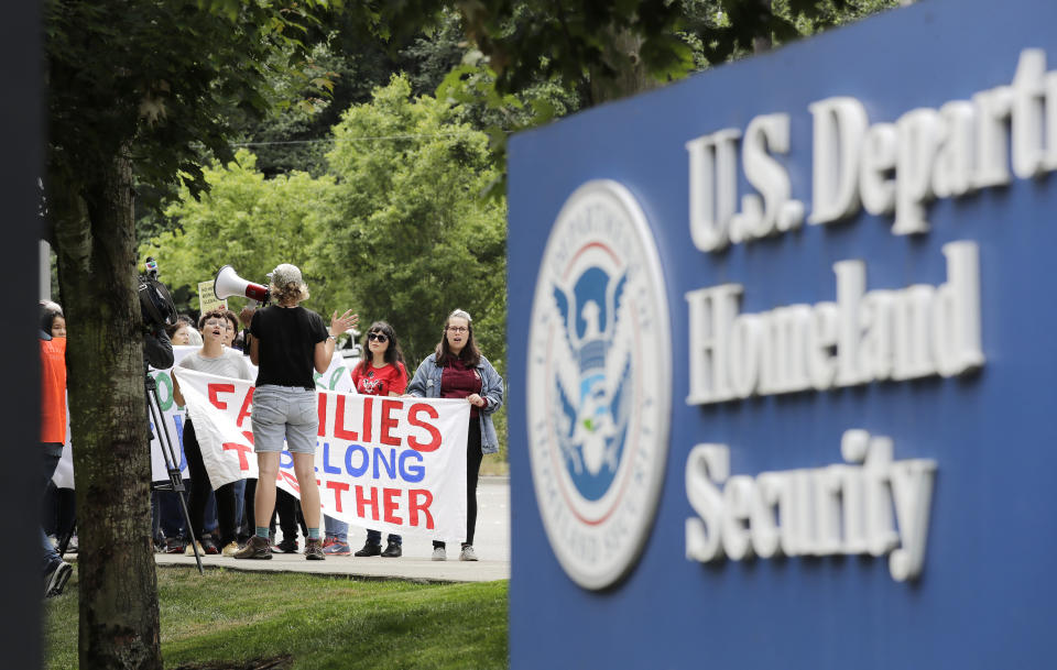 In this photo taken Wednesday, July 17, 2019, supporters of Jose Robles gather before he turned himself in to immigration authorities in Tukwila, Wash. The prospect of nationwide immigration raids has provided evidence that legions of pastors, rabbis and their congregations stand ready to help vulnerable immigrants with offers of sanctuary and other services. (AP Photo/Elaine Thompson)