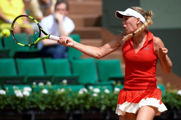 Denmark's Caroline Wozniacki hits a returns to Australia's Jaimee Fourlis during their French Open match at Roland Garros on May 29, 2017