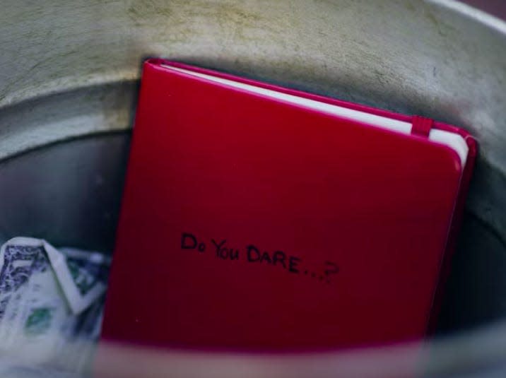 Dash and Lily - red notebook in trashcan