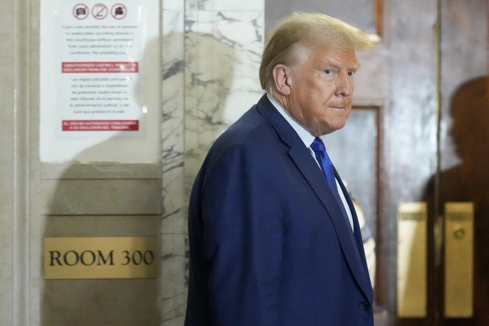 Former President Donald Trump returns to the courtroom after a break in his civil business fraud trial at New York Supreme Court, Wednesday, Oct. 25, 2023, in New York. The judge in Donald Trump's civil fraud trial has fined the former president $10,000. The judge says Trump violated a limited gag order barring personal attacks on court staffers.(AP Photo/Seth Wenig)