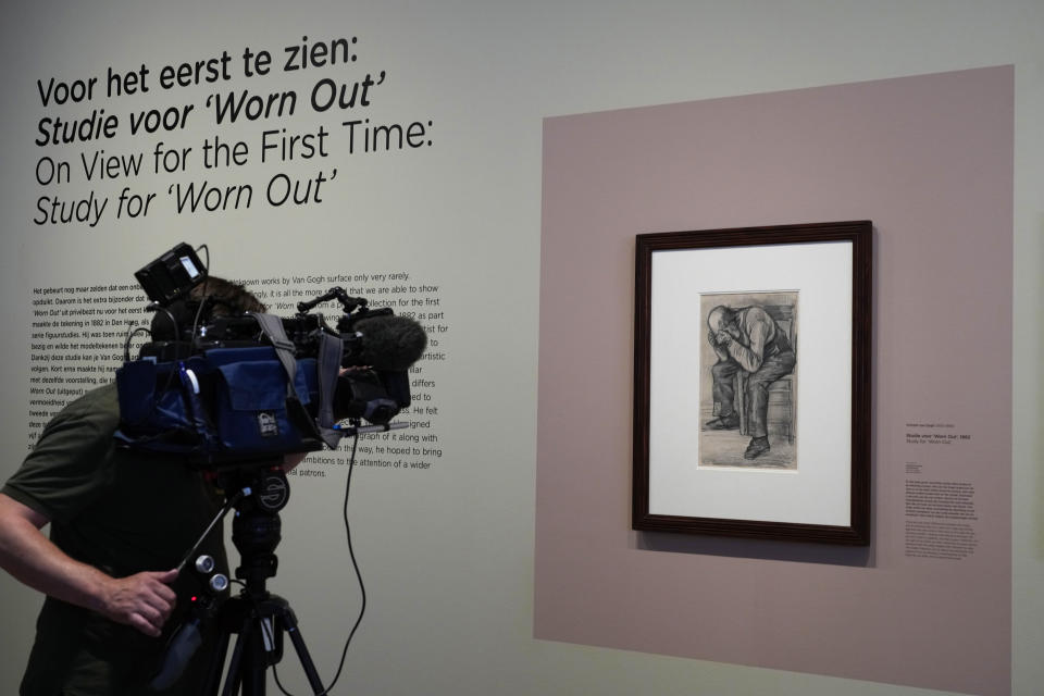 A cameraman takes pictures of Study for "Worn Out", a drawing by Dutch master Vincent van Gogh, dated Nov. 1882, on public display for the first time at the Van Gogh Museum in Amsterdam, Netherlands, Thursday, Sept. 16, 2021. (AP Photo/Peter Dejong)