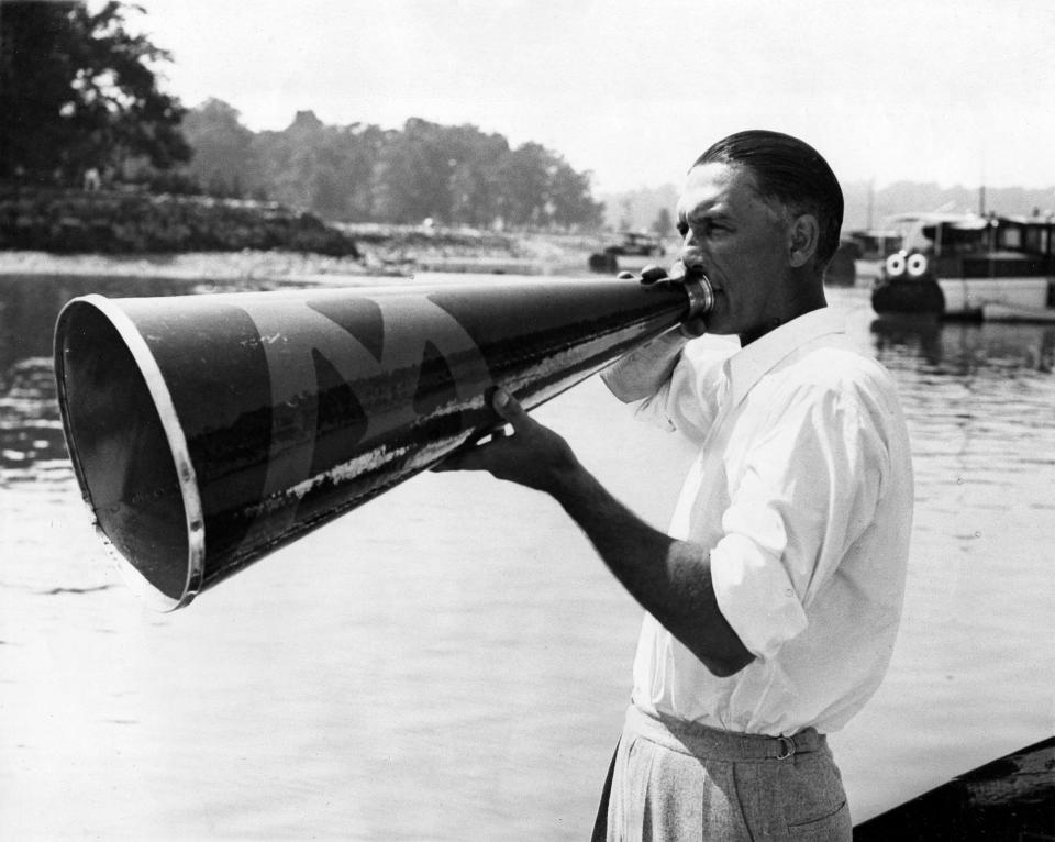 Al Ulbrickson, coach of the University of Washington crew, directs his Huskies in a workout on Long Island Sound, near New York, July 10, 1936. The Washington crew will sail shortly for Germany to represent the United States in the Olympic Games in Berlin. (AP Photo)