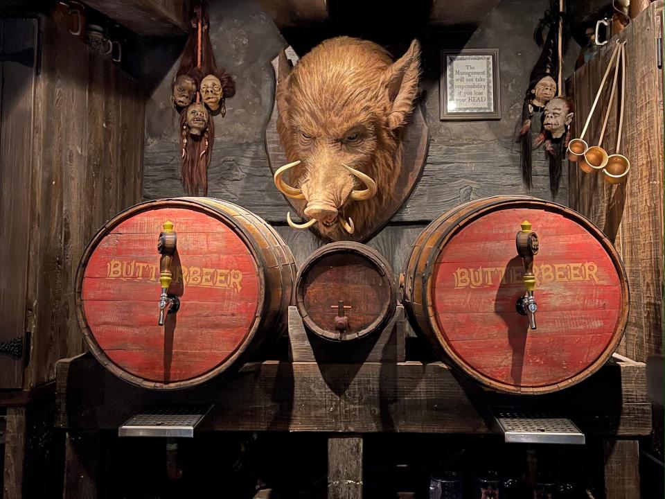 A wall in Hogs Head pub with a big hog and barrels