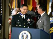 <p>Powell became a national figure in 1989, when he was promoted to a four-star general and became the 12th chairman of the Joint Chiefs of Staff under George H.W. Bush — the first Black person named to the position — and put in charge of the 1990 Gulf War.</p> <p>He continued his role as chairman into the administration of President Bill Clinton, resigning from the position in September 1993. He received the Presidential Medal of Freedom from both men.</p>