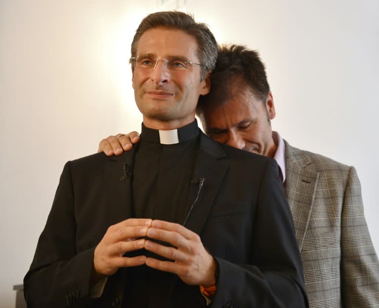 Father Krysztof Olaf Charamsa with his partner Edouard at a press conference where he reveal his homosexuality on October 3, 2015 in Rome