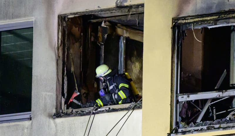 A firefighter works to extinguish the fire in a hospital.  Four people have died in a fire at a hospital in the northern German town of Uelzen, a police spokesman said on Friday. Philipp Schulze/dpa