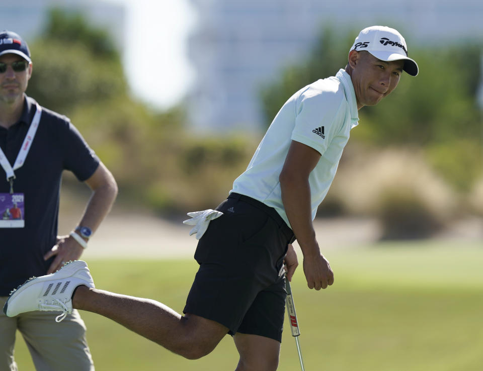 Collin Morikawa of the United States, reacts to his putt on the 18th hole during a Pro-Am tournament ahead of the Hero World Challenge PGA Tour at the Albany Golf Club, in New Providence, Bahamas, Wednesday, Dec., 1, 2021.(AP Photo/Fernando Llano)