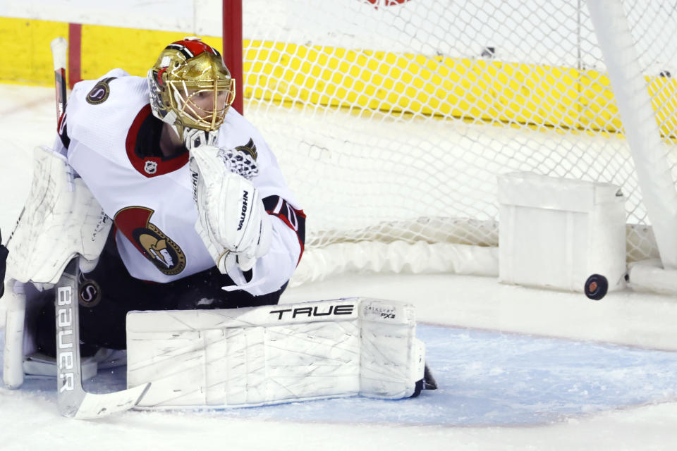 Ottawa Senators goalie Joonas Korpisalo gives up a goal to Calgary Flames' Yegor Sharangovich during the second period of an NHL hockey game Tuesday, Jan. 9, 2024, in Calgary, Alberta. (Larry MacDougal/The Canadian Press via AP)