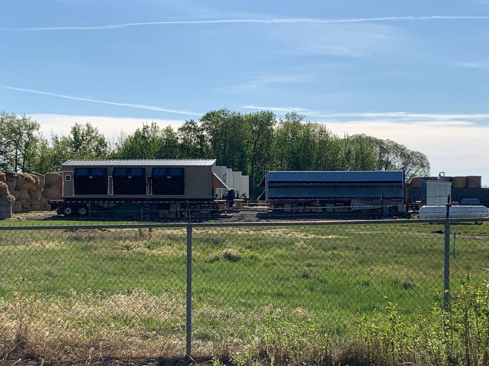 Link Global's bitcoin mining operation in Sturgeon County, seen here in the summer of 2021, consisted of shipping containers filled with computer servers. (David Bajer/CBC - image credit)
