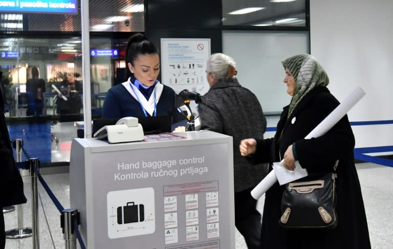 Srebrenica massacre survivor Fatima Gurdic, seen checking in for her flight to The Hague from Sarajevo, will be among those following proceedings Wednesday when a verdict is expected in the UN trial of Bosnian Serb military chief Ratko Mladic