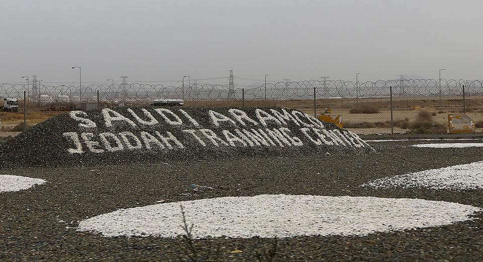 Barbed wire fence surround the North Jiddah bulk plant, an Aramco oil facility, in Jiddah, Saudi Arabia Thursday, March 4, 2021. Yemen's Houthi rebels said they struck a Saudi oil facility in the port city of Jiddah on Thursday, the latest in a series of cross-border attacks the group has claimed against the kingdom amid the grinding war in Yemen. A Houthi military spokesman tweeted that the rebels fired a new Quds-2 cruise missile at the facility. He posted a satellite image online that matched Aramco’s North Jiddah Bulk Plant, where oil products are stored in tanks. (AP Photo/Amr Nabil)