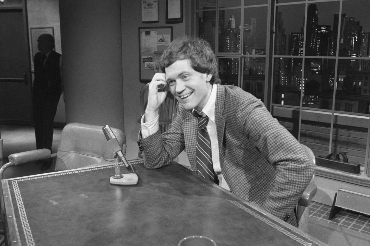 David Letterman smiles as he hosts the premiere of his talk show on NBC television, 