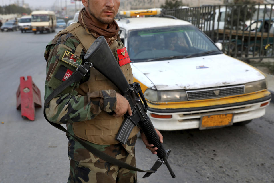 In this Tuesday, Sept. 24, 2019 photo, an Afghan National Army soldier stands guard at a checkpoint ahead of presidential elections scheduled for Sept. 28, in Kabul, Afghanistan. Roughly 9% of polling centers won’t open due to insecurity. Afghanistan's Independent Election Commission requested security for 5,373 polling centers, but security agencies said 410 polling centers were impossible to secure and would be closed on Saturday. (AP Photo/Ebrahim Noroozi)