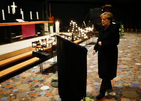 German Chancellor Angela Merkel arrives to sign the condolence book at the Gedaechniskirche in Berlin, Germany, December 20, 2016, one day after a truck ploughed into a crowded Christmas market in the German capital. REUTERS/Hannibal Hanschke