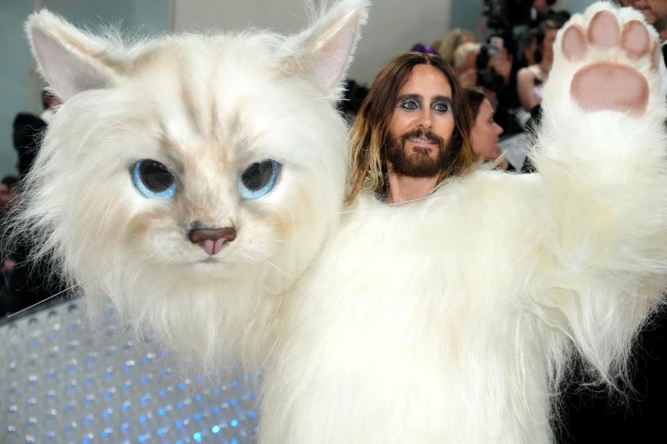 Jared Leto in Choupette costume holding Choupette head