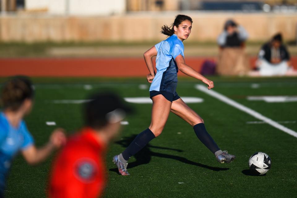 Poudre girls soccer player Sybil Arabi (8) passes during a match against Fossil Ridge on April 6, 2023, at Poudre High School in Fort Collins.