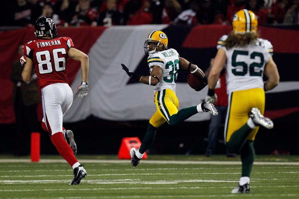 ATLANTA, GA - JANUARY 15:  Tramon Williams ##8 of the Green Bay Packers returns an interception 70-yards for a touchdown in the second quarter against the Atlanta Falcons during their 2011 NFC divisional playoff game at Georgia Dome on January 15, 2011 in Atlanta, Georgia.  (Photo by Kevin C. Cox/Getty Images)