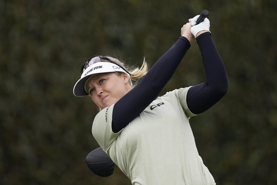 Brooke M. Henderson tees off from the first fairway during the final round of the LPGA's Hugel-Air Premia LA Open golf tournament at Wilshire Country Club Saturday, April 24, 2021, in Los Angeles. (AP Photo/Ashley Landis)