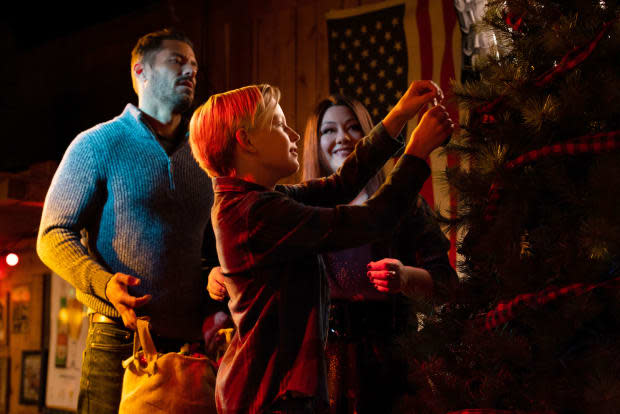 <p>(L to R) Brandon Quinn, Caden Dragomer and Brooke Elliott star in <em>A Country Christmas Harmony</em><br> ©2022 A+E Networks, LLC. All rights reserved.<br> Photo Credit: Victor Curtis / Courtesy of A+E Networks and Lifetime</p>