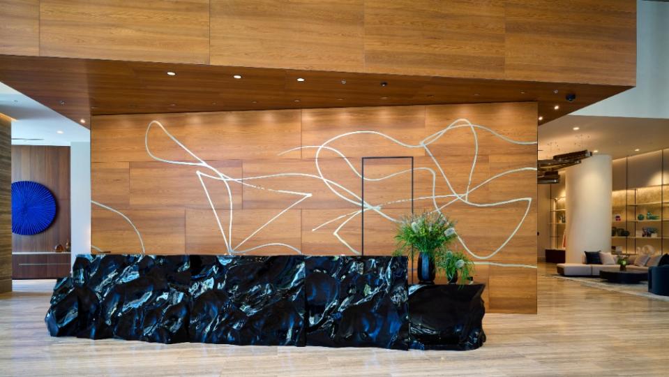 The lobby, featuring a one-of-kind Gehry-designed line drawing. - Credit: Weldon Brewster