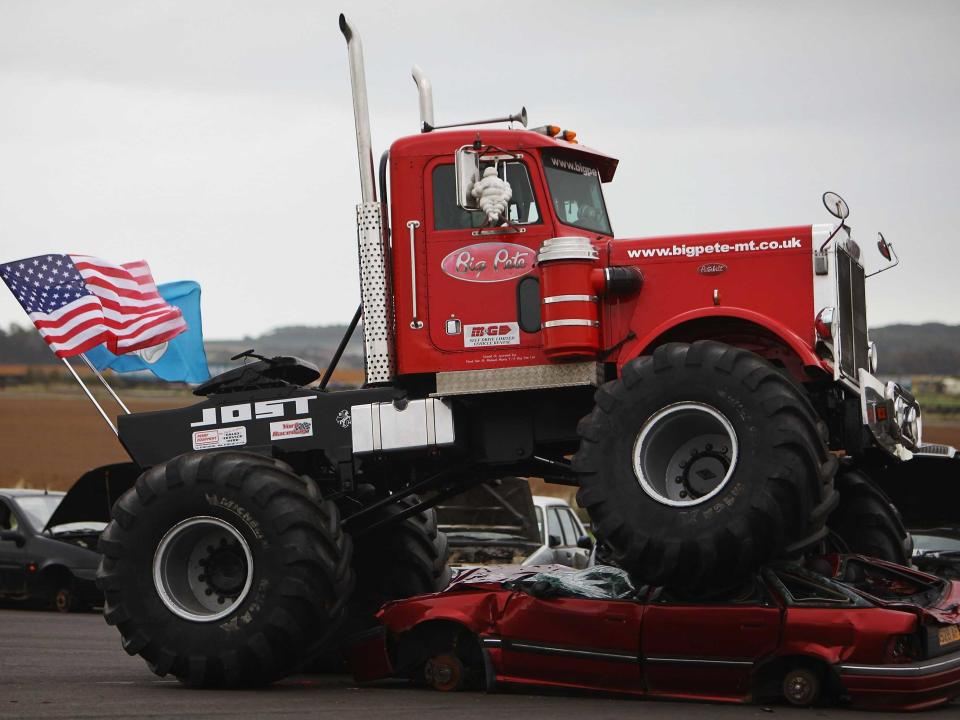 monster truck crushing car usa flag