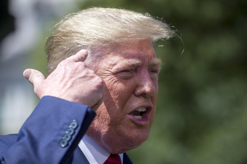 President Donald Trump speaks with reporters before departing on Marine One on the South Lawn of the White House, Wednesday, Aug. 21, 2019, in Washington. (AP Photo/Alex Brandon)