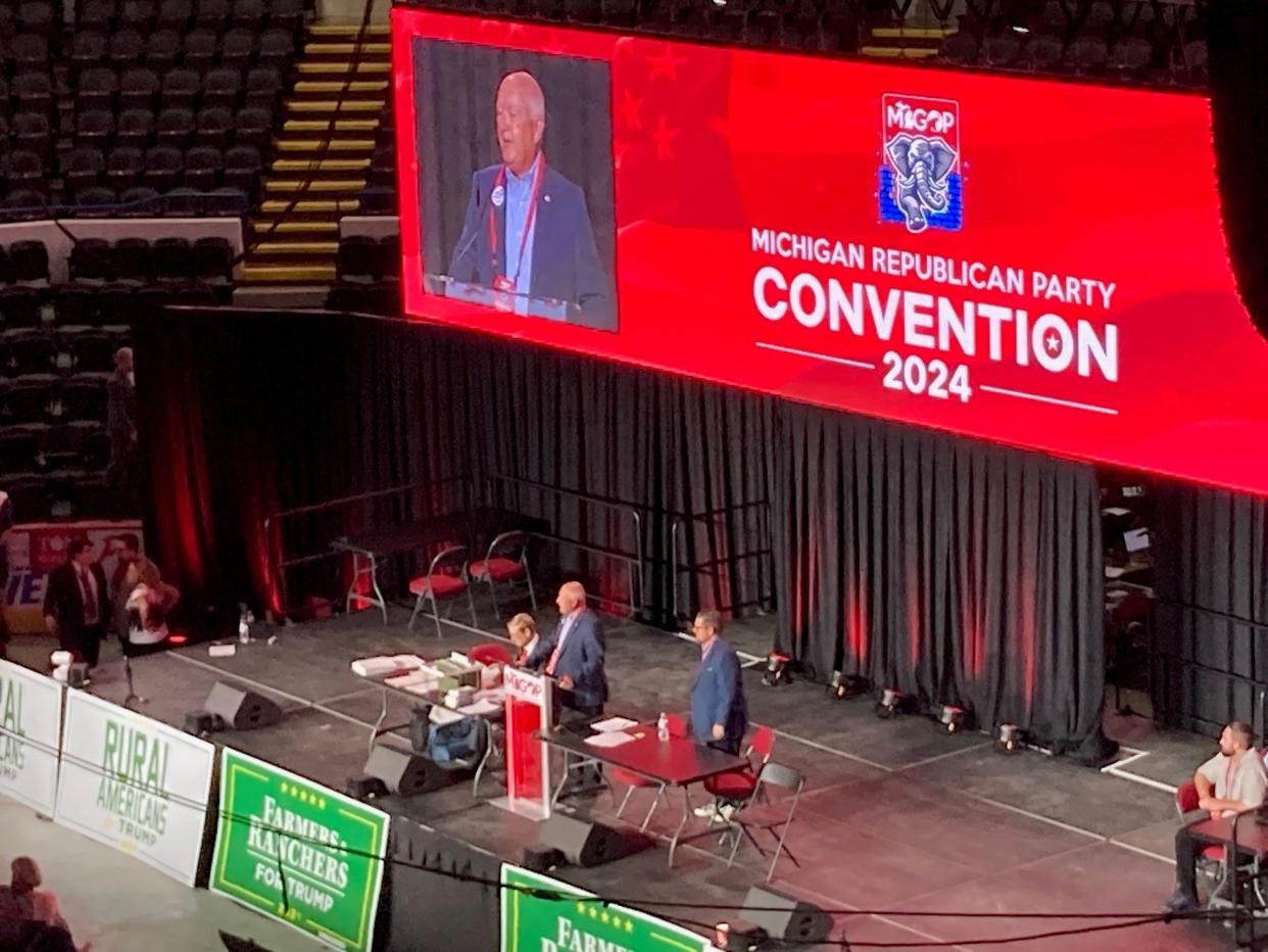 Michigan Republican Party Chairman Pete Hoekstra addresses a sometimes raucous state party convention in Flint Saturday.