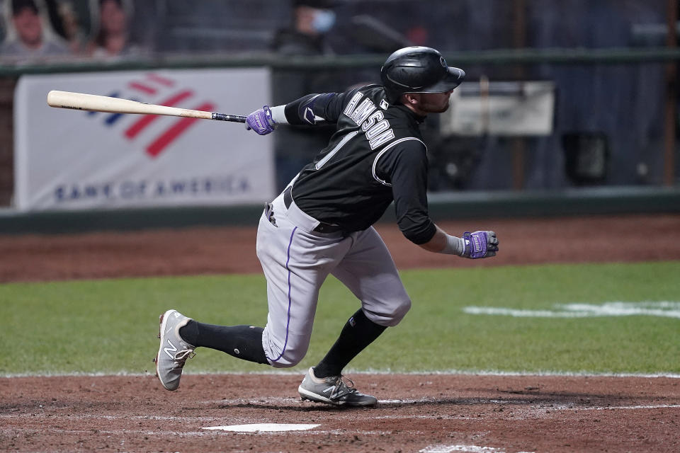 Colorado Rockies' Garrett Hampson (1) hits a single to drive in a run against the San Francisco Giants during the fifth inning of a baseball game on Monday, Sept. 21, 2020, in San Francisco. (AP Photo/Tony Avelar)