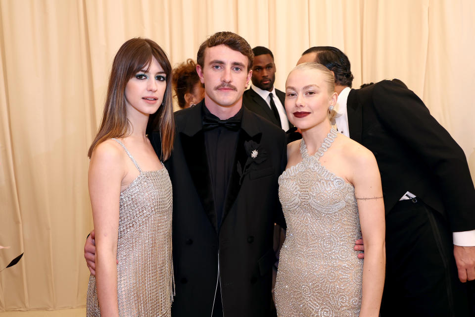 Daisy Edgar-Jones, Paul Mescal, and Phoebe Bridgers on the red carpet, with Daisy and Phoebe in sleeveless gowns and Paul in a black tuxedo