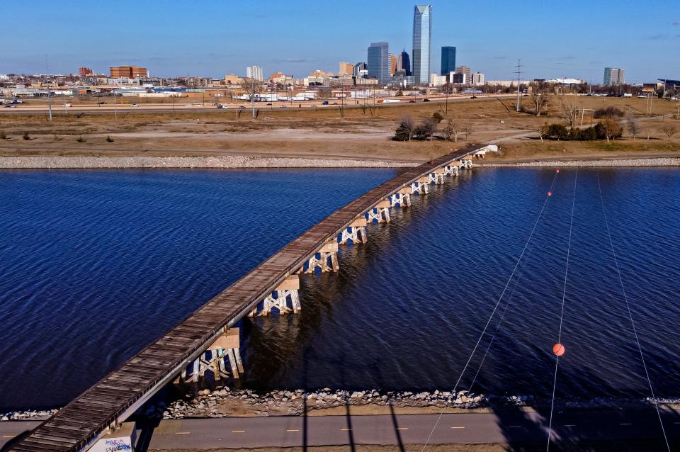 The abandoned rail bridge, built in 1956, over the Oklahoma River in Oklahoma City pictured on Monday, Dec. 19, 2022, is scheduled to be replaced by a pedestrian bridge in 2024.