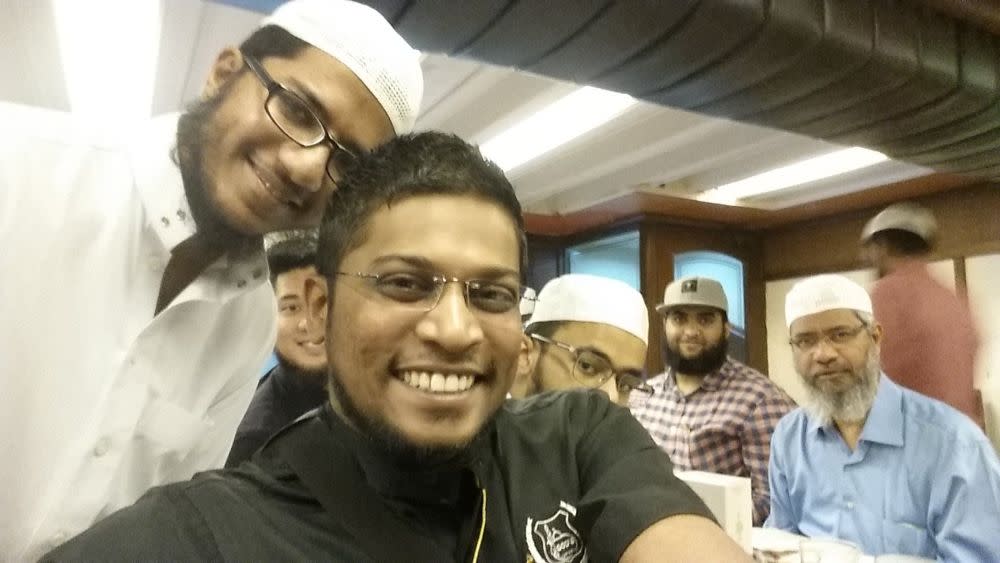 Zamri Vinoth (in black) is pictured during a meeting with controversial preacher Dr Zakir Naik (far right). — Picture via Twitter