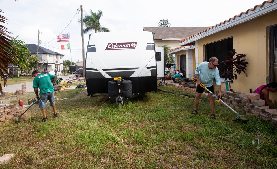 Volunteers descended on Joe Salvaggio's Fort Myers Beach home on Sunday, Aug. 20, 2023 to help clean it up. Salvaggio, 84, survived Hurricane Ian in the attic of his home. After hearing a media report involving a dispute with his contractor for work not getting done, volunteers stepped in and are helping him get the necessary repairs done on his home.