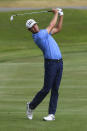 Harris English hits on the 18th hole during the third round in the World Golf Championship-FedEx St. Jude Invitational tournament, Saturday, Aug. 7, 2021, in Memphis, Tenn. (AP Photo/John Amis)