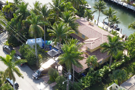 Federal law enforcement vehicles are seen parked at the home of Roger Stone in an aerial photo taken after his arrest in Fort Lauderdale, Florida, U.S., January 25, 2019. REUTERS/Dronebase