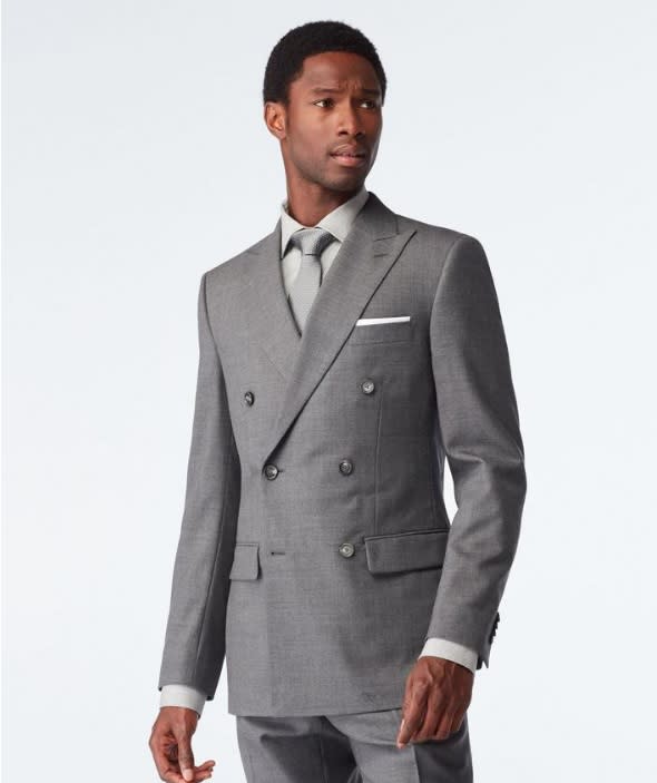 Model wearing a light grey double breasted Indochino suit