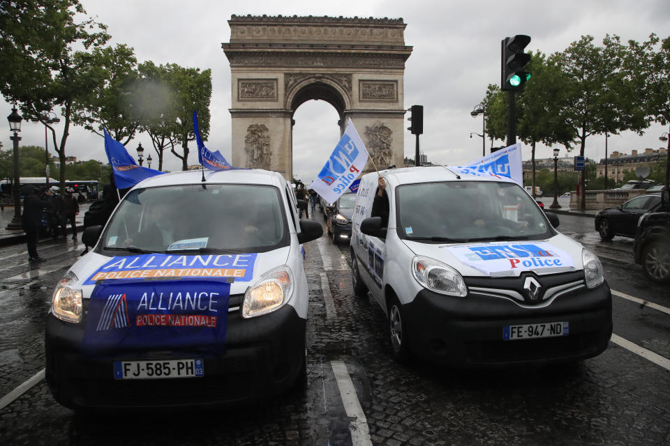 French police unionists demonstrate on the Champs-Elysee din front of the Arc de Triomphe, Friday, June 12, 2020 in Paris. French police are protesting a new ban on chokeholds and limits to what they can do during arrests, part of government efforts to stem police brutality and racism in the wake of global protests over George Floyd's death in the U.S. (AP Photo/Michel Euler)